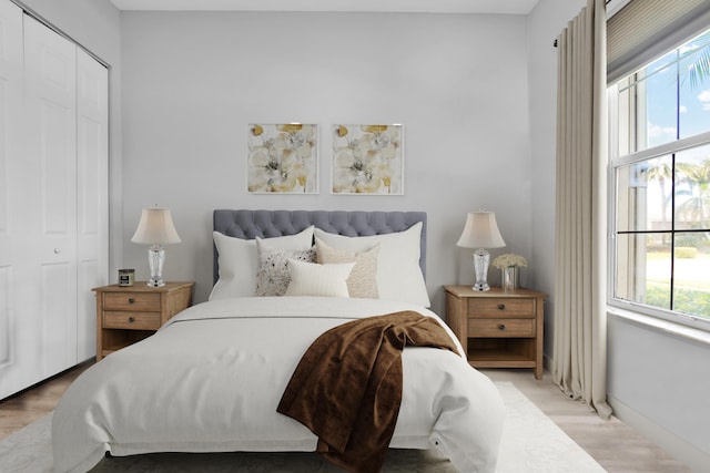 14841 Strand Ln (), Unit Delray Beach, FL 33446 - bedroom featuring a closet, wood finished floors, and baseboards