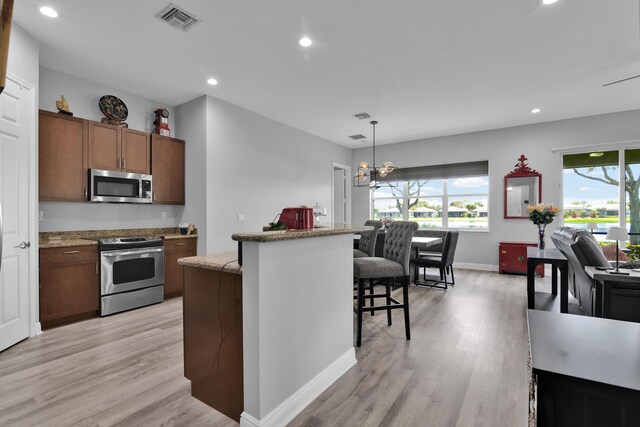 14841 Strand Ln (), Unit Delray Beach, FL 33446 - kitchen with appliances with stainless steel finishes, light wood-style flooring, healthy amount of natural light, and recessed lighting