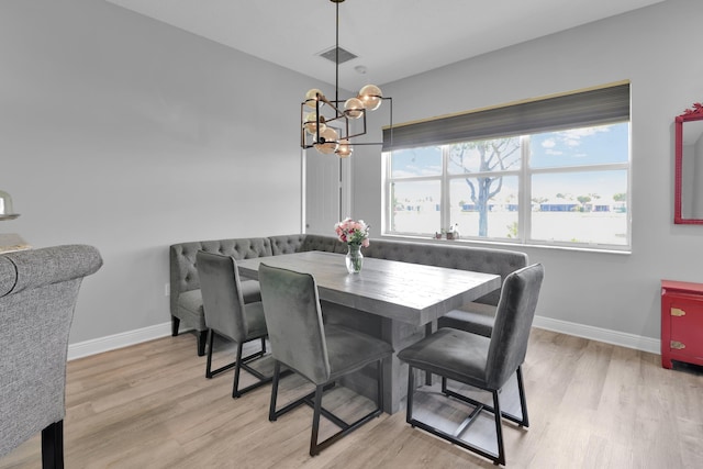 14841 Strand Ln (), Unit Delray Beach, FL 33446 - dining space featuring a chandelier, baseboards, and light wood-style floors