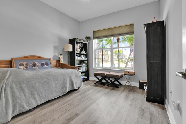 14841 Strand Ln (), Unit Delray Beach, FL 33446 - bedroom with wood finished floors and baseboards