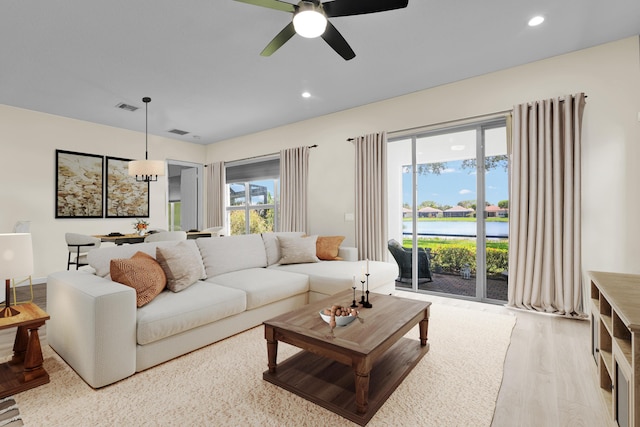 14841 Strand Ln (), Unit Delray Beach, FL 33446 - living area with ceiling fan, light wood-style flooring, recessed lighting, and a water view