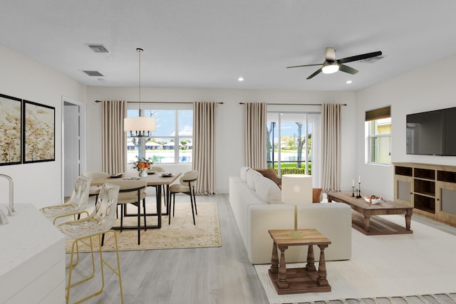 14841 Strand Ln (), Unit Delray Beach, FL 33446 - living area with light wood-style flooring, ceiling fan, recessed lighting, and a tile fireplace