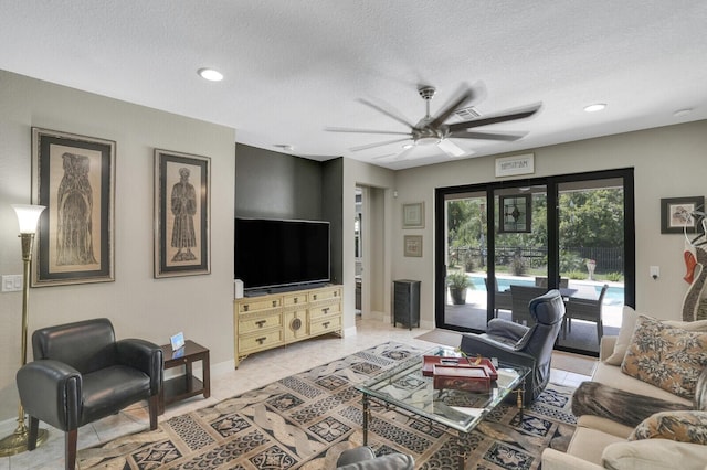 4884 SW Gossamer Cir, Palm City, FL 34990 - living room featuring ceiling fan, baseboards, a textured ceiling, light tile patterned floors, and recessed lighting