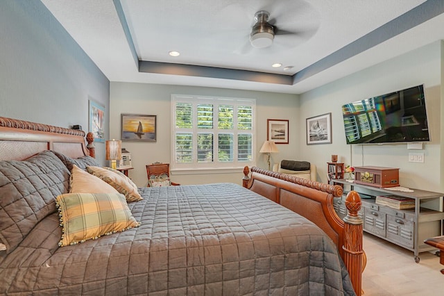 4884 SW Gossamer Cir, Palm City, FL 34990 - bedroom with a tray ceiling, recessed lighting, and a ceiling fan