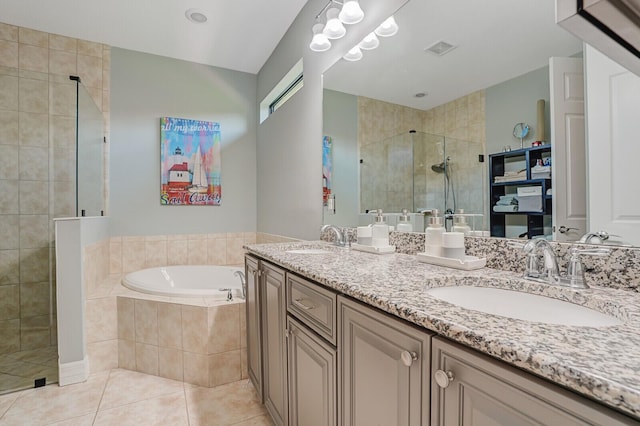 4884 SW Gossamer Cir, Palm City, FL 34990 - bathroom featuring a shower stall, a garden tub, double vanity, and tile patterned flooring