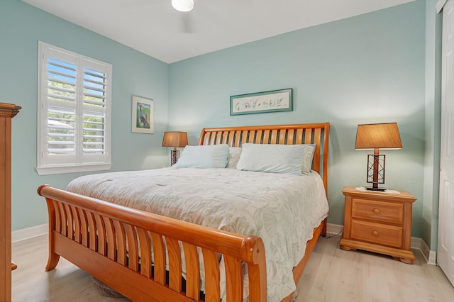 4884 SW Gossamer Cir, Palm City, FL 34990 - bedroom with baseboards and wood finished floors