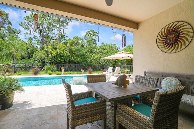 4884 SW Gossamer Cir, Palm City, FL 34990 - fenced backyard with a patio and view of scattered trees