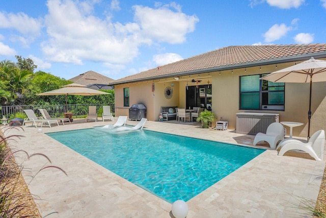 4884 SW Gossamer Cir, Palm City, FL 34990 - view of swimming pool featuring a patio area, a ceiling fan, and area for grilling