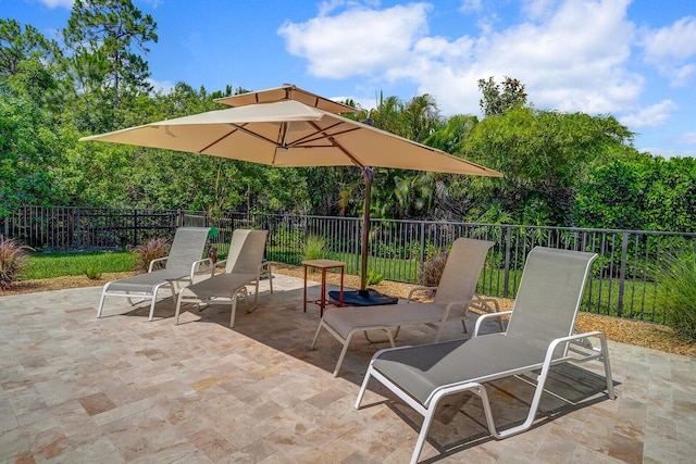 4884 SW Gossamer Cir, Palm City, FL 34990 - view of patio / terrace featuring view of wooded area