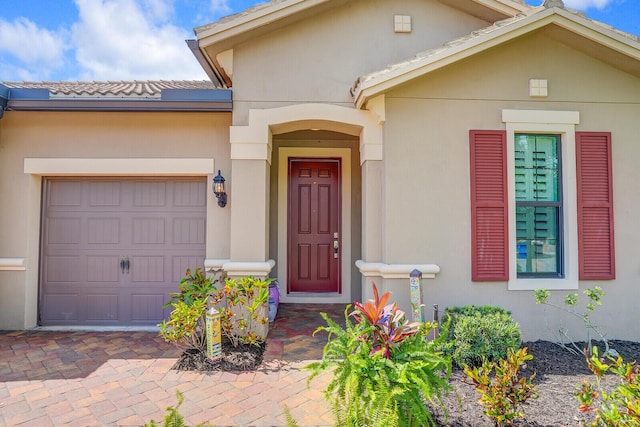 4884 SW Gossamer Cir, Palm City, FL 34990 - doorway to property with a garage and driveway