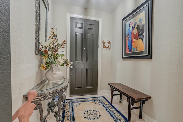 4884 SW Gossamer Cir, Palm City, FL 34990 - entrance foyer with baseboards and a textured wall
