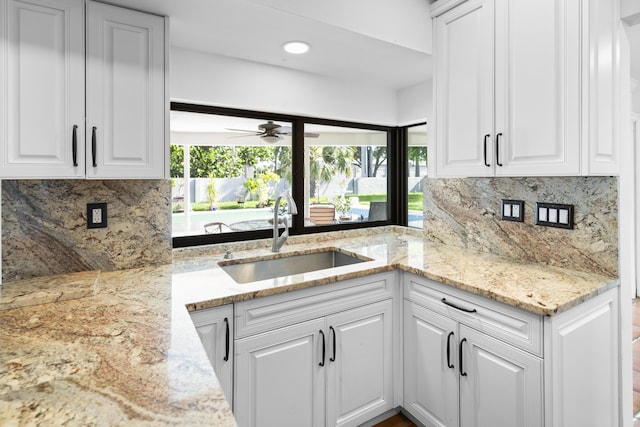1318 NW 4th St, Boca Raton, FL 33486 - kitchen featuring healthy amount of natural light, tasteful backsplash, white cabinets, and recessed lighting