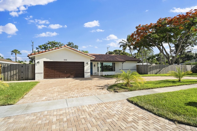 1318 NW 4th St, Boca Raton, FL 33486 - view of front facade with a garage, decorative driveway, a tiled roof, and stucco siding