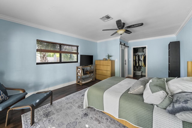 1318 NW 4th St, Boca Raton, FL 33486 - bedroom with a barn door, wood finished floors, ornamental molding, ceiling fan, and a closet