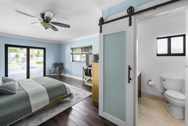 1318 NW 4th St, Boca Raton, FL 33486 - bedroom with a barn door, crown molding, and ceiling fan