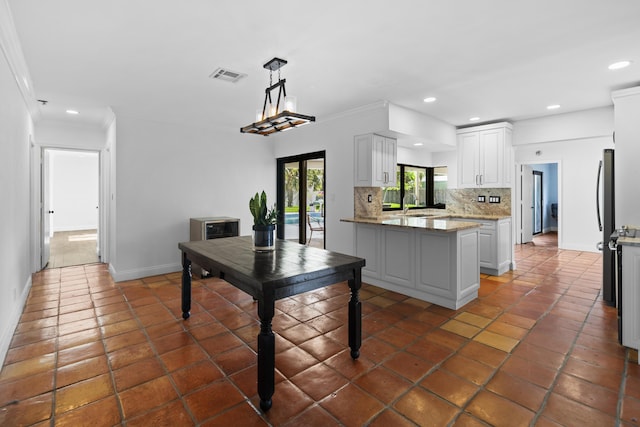 1318 NW 4th St, Boca Raton, FL 33486 - kitchen featuring backsplash, recessed lighting, white cabinets, dark tile patterned floors, and ornamental molding