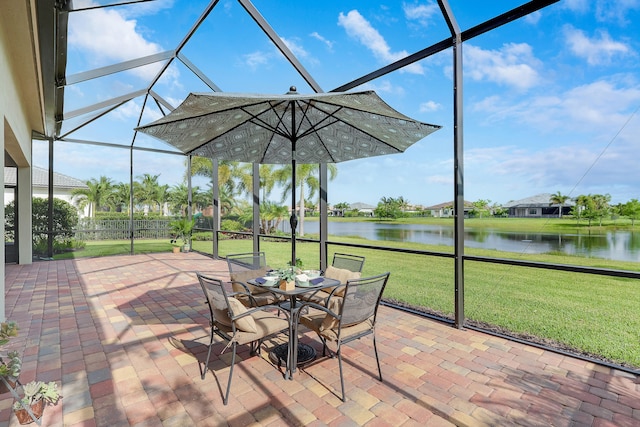 11620 Sally Ann Dr, Palm Beach Gardens, FL 33412 - view of patio featuring a water view, glass enclosure, and outdoor dining area