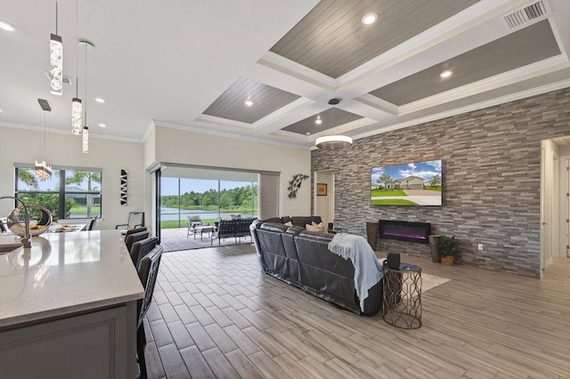 11620 Sally Ann Dr, Palm Beach Gardens, FL 33412 - living room with a stone fireplace, wood finished floors, crown molding, recessed lighting, and beamed ceiling