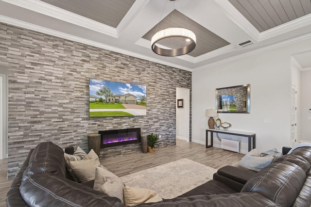 11620 Sally Ann Dr, Palm Beach Gardens, FL 33412 - living area with coffered ceiling, ornamental molding, wood finished floors, a glass covered fireplace, and beam ceiling