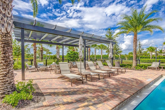 11620 Sally Ann Dr, Palm Beach Gardens, FL 33412 - view of patio with a pergola and a community pool
