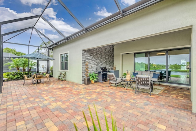 11620 Sally Ann Dr, Palm Beach Gardens, FL 33412 - view of patio with grilling area, outdoor dining space, an outdoor living space, and glass enclosure
