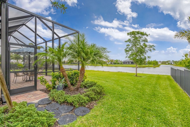 11620 Sally Ann Dr, Palm Beach Gardens, FL 33412 - view of yard featuring a water view, glass enclosure, and a patio
