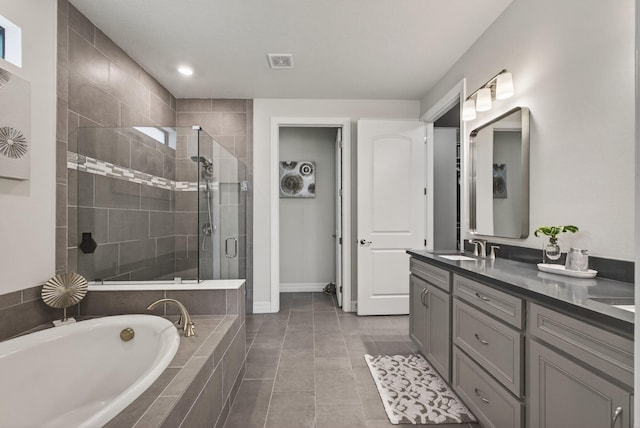 11620 Sally Ann Dr, Palm Beach Gardens, FL 33412 - full bath with a shower stall, double vanity, a bath, tile patterned floors, and baseboards