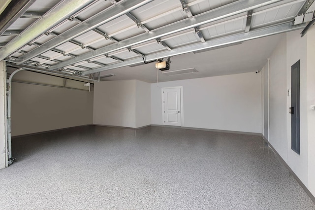 11620 Sally Ann Dr, Palm Beach Gardens, FL 33412 - garage featuring a garage door opener and baseboards