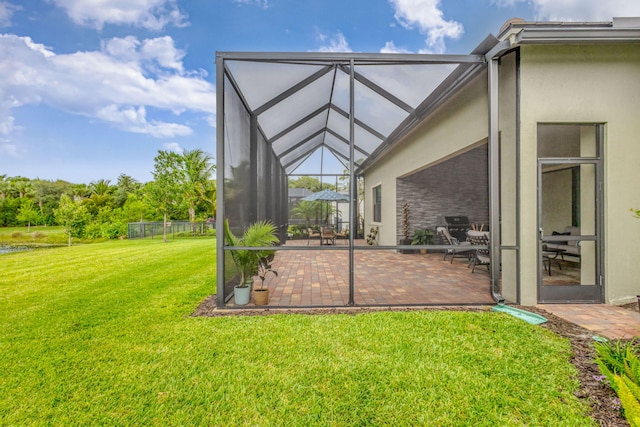 11620 Sally Ann Dr, Palm Beach Gardens, FL 33412 - view of green lawn with a patio and a lanai