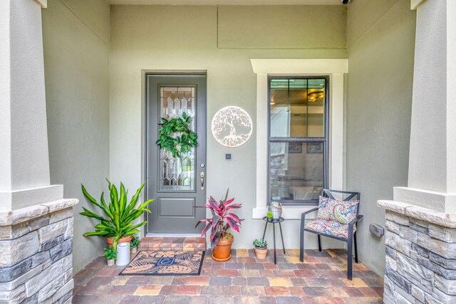 11620 Sally Ann Dr, Palm Beach Gardens, FL 33412 - property entrance featuring stucco siding and a porch