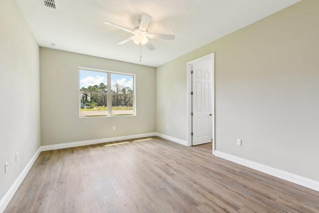 518 Scodella St SW, Palm Bay, FL 32908 - spare room with a ceiling fan, wood finished floors, and baseboards