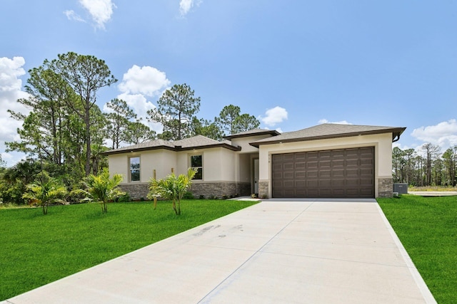 518 Scodella St SW, Palm Bay, FL 32908 - prairie-style house featuring stone siding, stucco siding, an attached garage, and concrete driveway