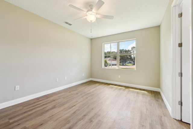 518 Scodella St SW, Palm Bay, FL 32908 - empty room featuring ceiling fan, light wood-style floors, and baseboards