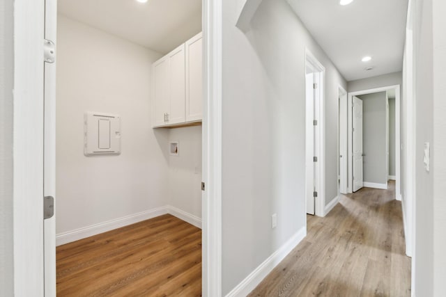 518 Scodella St SW, Palm Bay, FL 32908 - washroom featuring light wood finished floors, hookup for a washing machine, baseboards, cabinet space, and recessed lighting