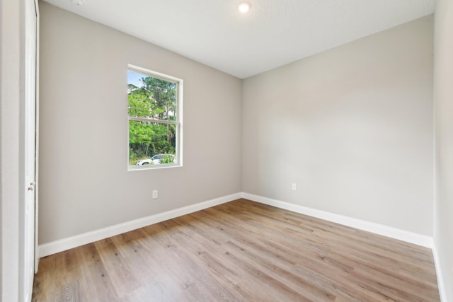 518 Scodella St SW, Palm Bay, FL 32908 - empty room featuring baseboards, light wood-type flooring, and recessed lighting