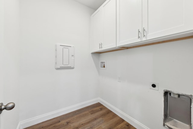 518 Scodella St SW, Palm Bay, FL 32908 - laundry room featuring electric dryer hookup, cabinet space, washer hookup, baseboards, and wood finished floors