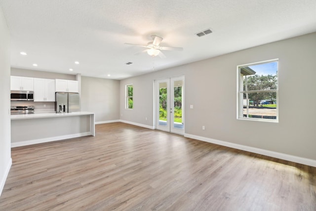 518 Scodella St SW, Palm Bay, FL 32908 - unfurnished living room featuring healthy amount of natural light, a ceiling fan, baseboards, and recessed lighting