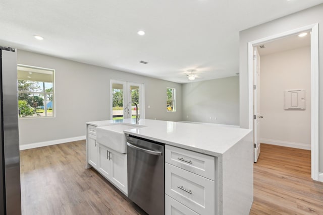 518 Scodella St SW, Palm Bay, FL 32908 - kitchen with appliances with stainless steel finishes, a sink, white cabinetry, plenty of natural light, and recessed lighting