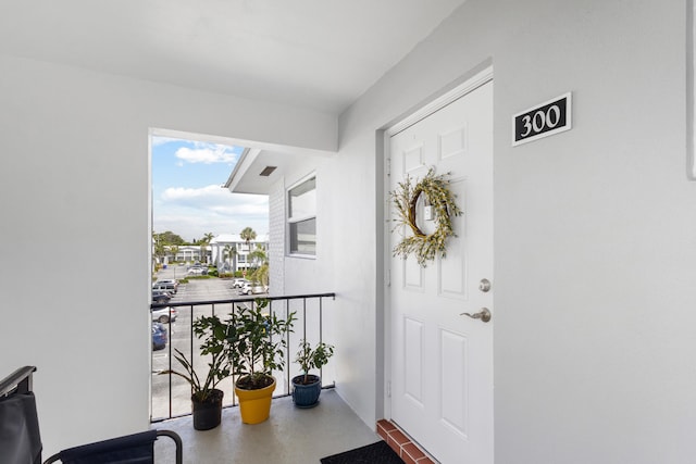 7 Colonial Club Dr Unit 300, Boynton Beach, FL 33435 - doorway to property with a balcony