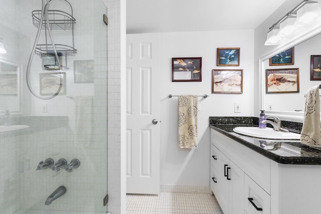 7 Colonial Club Dr Unit 300, Boynton Beach, FL 33435 - bathroom with vanity, tiled shower, and tile patterned floors