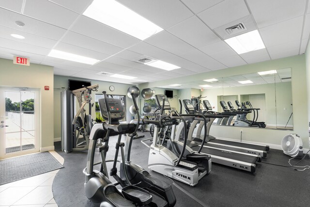 7 Colonial Club Dr Unit 300, Boynton Beach, FL 33435 - workout area featuring a drop ceiling and baseboards