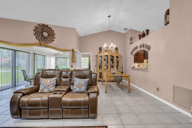 5830 Parkwalk Cir W, Boynton Beach, FL 33472 - living room with a chandelier, vaulted ceiling, baseboards, light tile patterned floors, and a textured ceiling