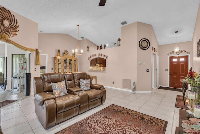 5830 Parkwalk Cir W, Boynton Beach, FL 33472 - living area featuring a chandelier, light tile patterned floors, baseboards, a ceiling fan, and high vaulted ceiling