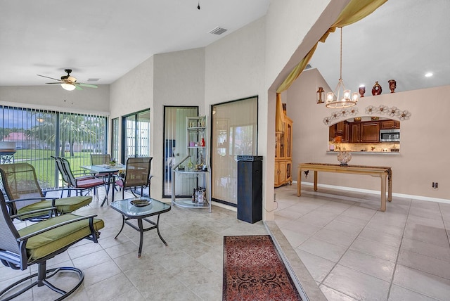 5830 Parkwalk Cir W, Boynton Beach, FL 33472 - living area with ceiling fan, a chandelier, light tile patterned floors, baseboards, and lofted ceiling