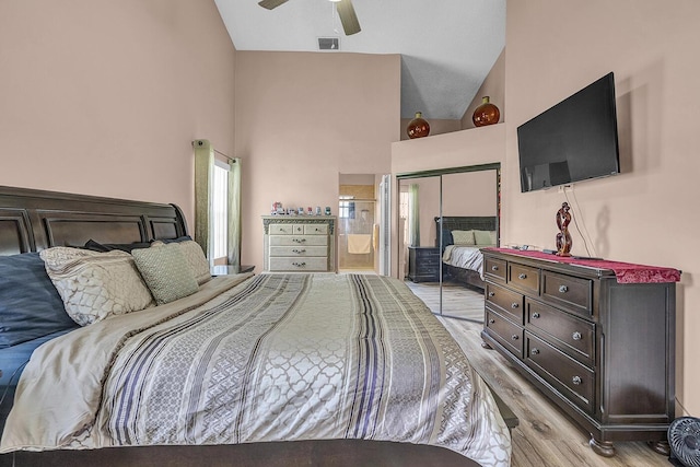 5830 Parkwalk Cir W, Boynton Beach, FL 33472 - bedroom featuring a closet, light wood-type flooring, high vaulted ceiling, ceiling fan, and ensuite bathroom