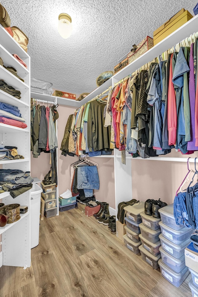 5830 Parkwalk Cir W, Boynton Beach, FL 33472 - walk in closet featuring wood finished floors