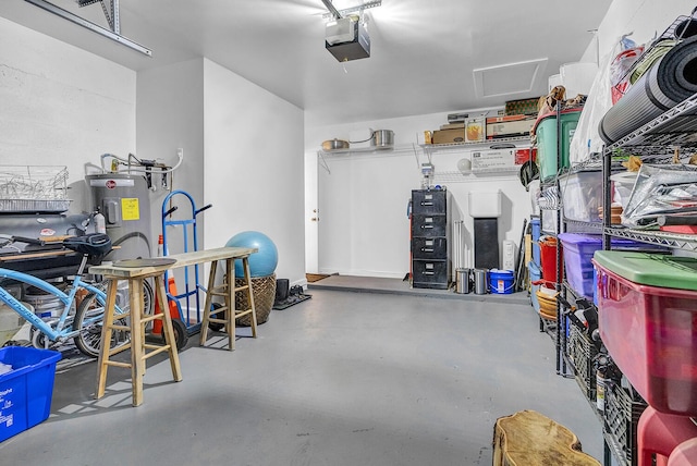 5830 Parkwalk Cir W, Boynton Beach, FL 33472 - garage featuring a garage door opener and water heater