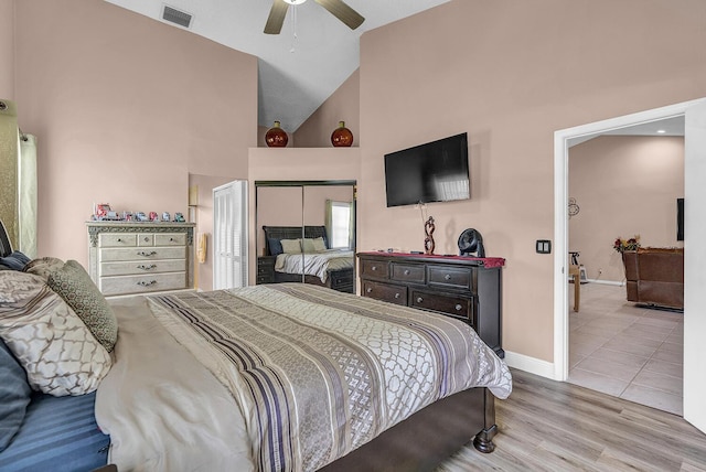 5830 Parkwalk Cir W, Boynton Beach, FL 33472 - bedroom featuring high vaulted ceiling, baseboards, light wood-style flooring, and a ceiling fan