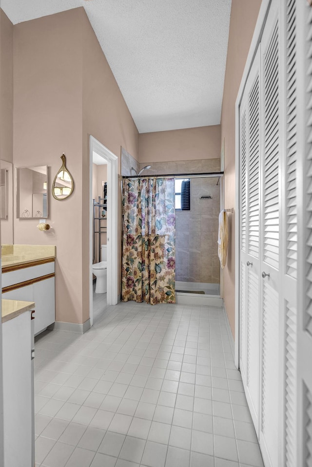 5830 Parkwalk Cir W, Boynton Beach, FL 33472 - full bath featuring a closet, vanity, a stall shower, toilet, and tile patterned flooring