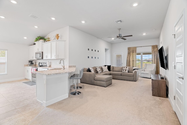 5309 Vespera St, Fort Pierce, FL 34951 - living area with recessed lighting, light colored carpet, a ceiling fan, baseboards, and vaulted ceiling